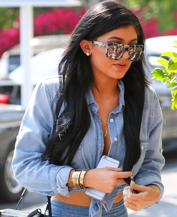 Kylie Jenner transformed a blue-denim button-down shirt into a crop top