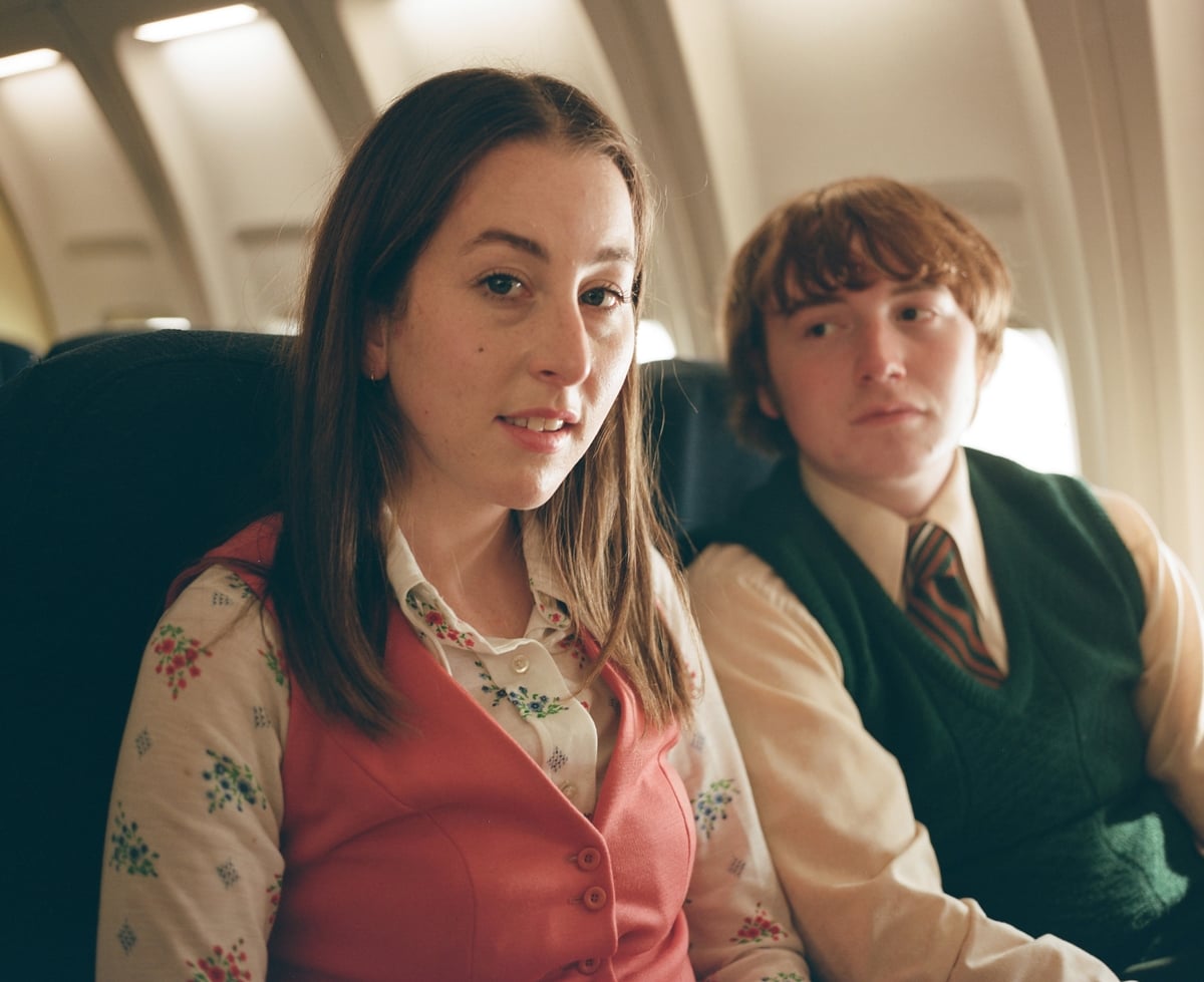 Alana Haim as photographer's assistant Alana Kane and Cooper Hoffman as Gary Valentine in the 2021 American coming-of-age comedy-drama film Licorice Pizza