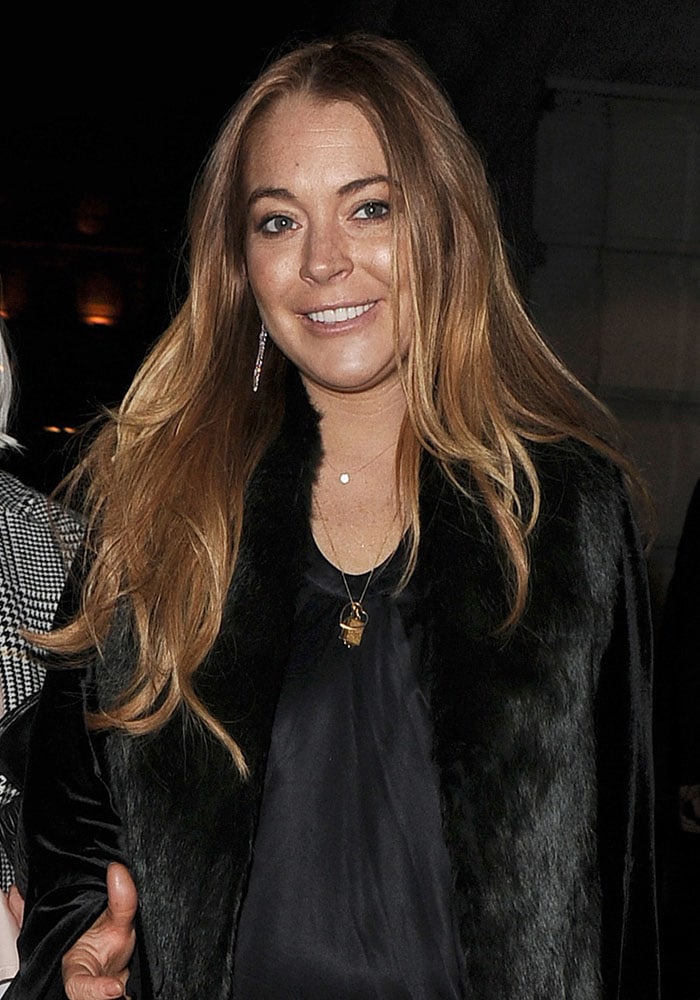 Lindsay Lohan in an oversized velvet-and-fur coat