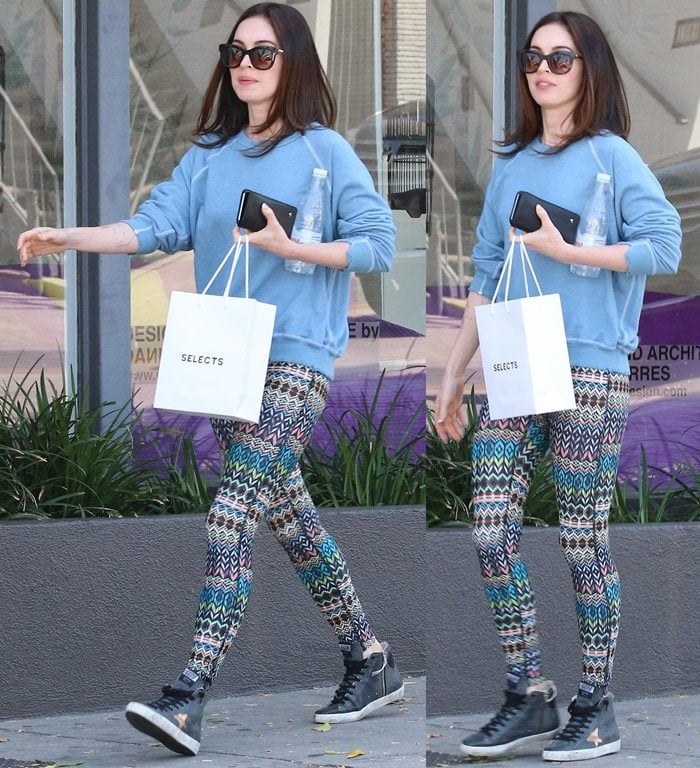 Megan Fox in colorful tribal patterned leggings and a plain blue sweatshirt