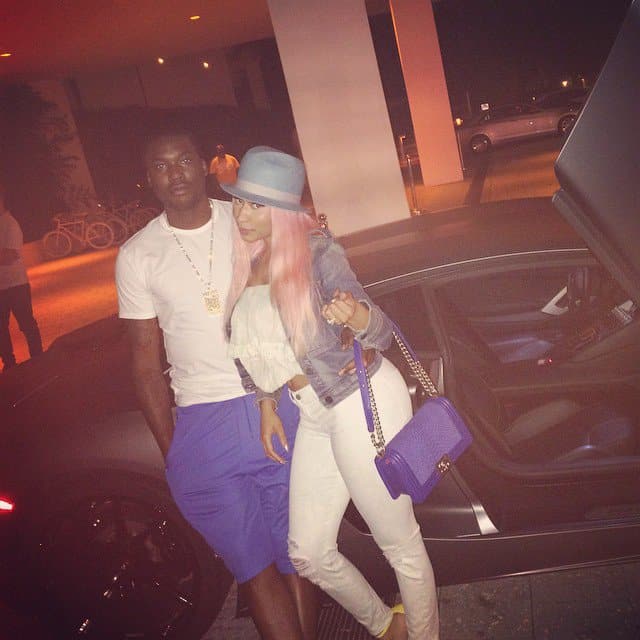 Nicki Minaj posted a photo of herself and the Philadelphia rapper Meek Mill posing together in front of a luxury sports car in Miami with the caption "Those Miami nights"