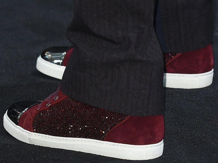 Closeup of Robert Downey Jr.'s burgundy suede sneakers with crystal-studded sides and silver toe caps