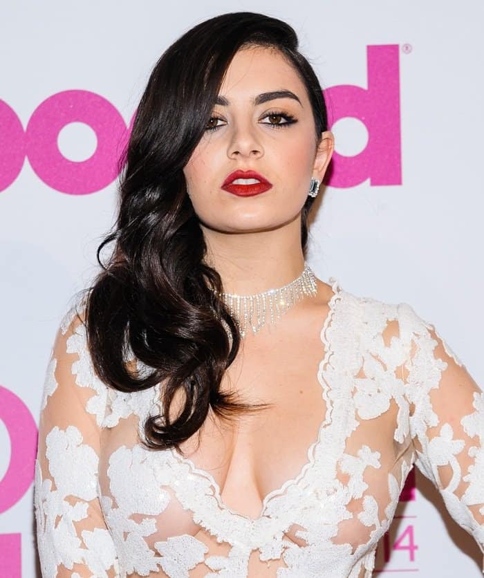 Charli XCX's dress, a creation from Betsey Johnson's spring/summer 2015 collection, possessed an intricate lace design that could have been deemed stunning if not for its sheer transparency at the Billboard Women in Music Luncheon