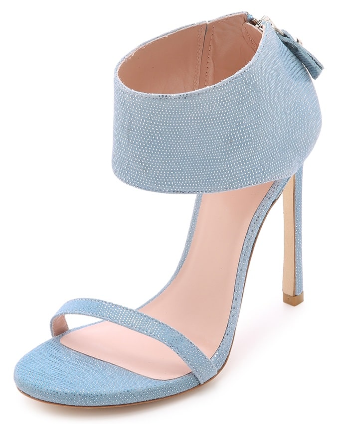 These sky blue sandals make a glamorous impression in embossed, metallic leather