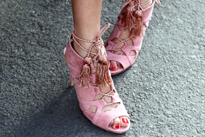 Anoushka's pink lace-up sandals with tassel tie ends