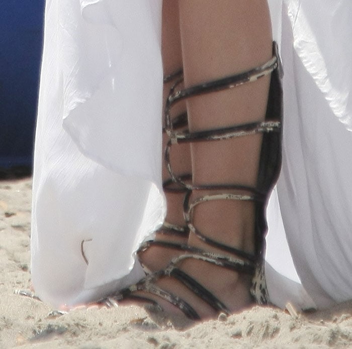 Bella Thorne wears BCBGMaxazria sandals