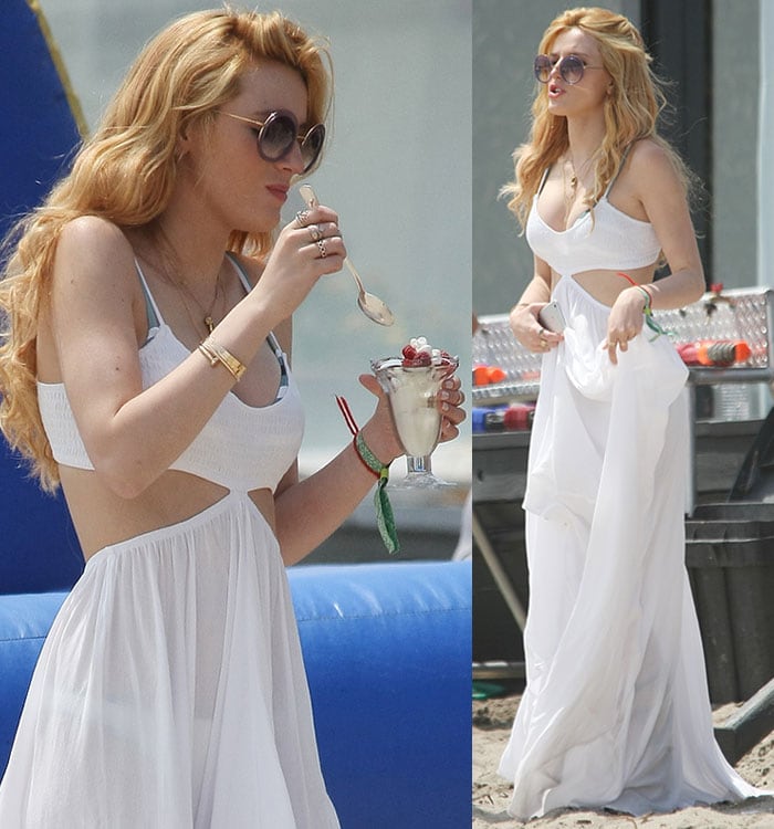 Bella Thorne accessorized with earrings, layers of necklaces, Cartier bangles, some rings, and friendship bracelets