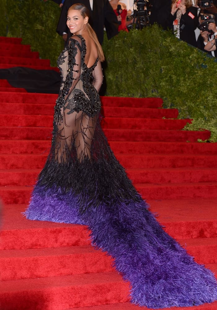 Beyonce dazzles in a sheer black and purple feathered Givenchy gown at the 2012 Met Gala