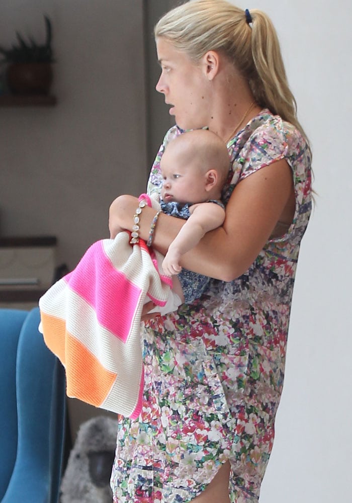 Busy Philipps carrying Ali Larter's daughter Vivienne Margaret MacArthur