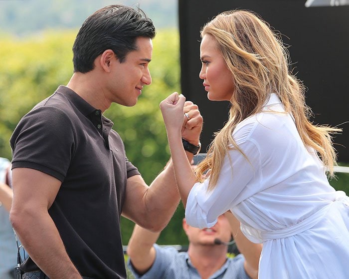 Chrissy Teigen appears on "Extra" with host Mario Lopez at Universal Studios