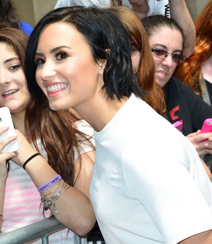 Demi Lovato's raven locks were swept to one side