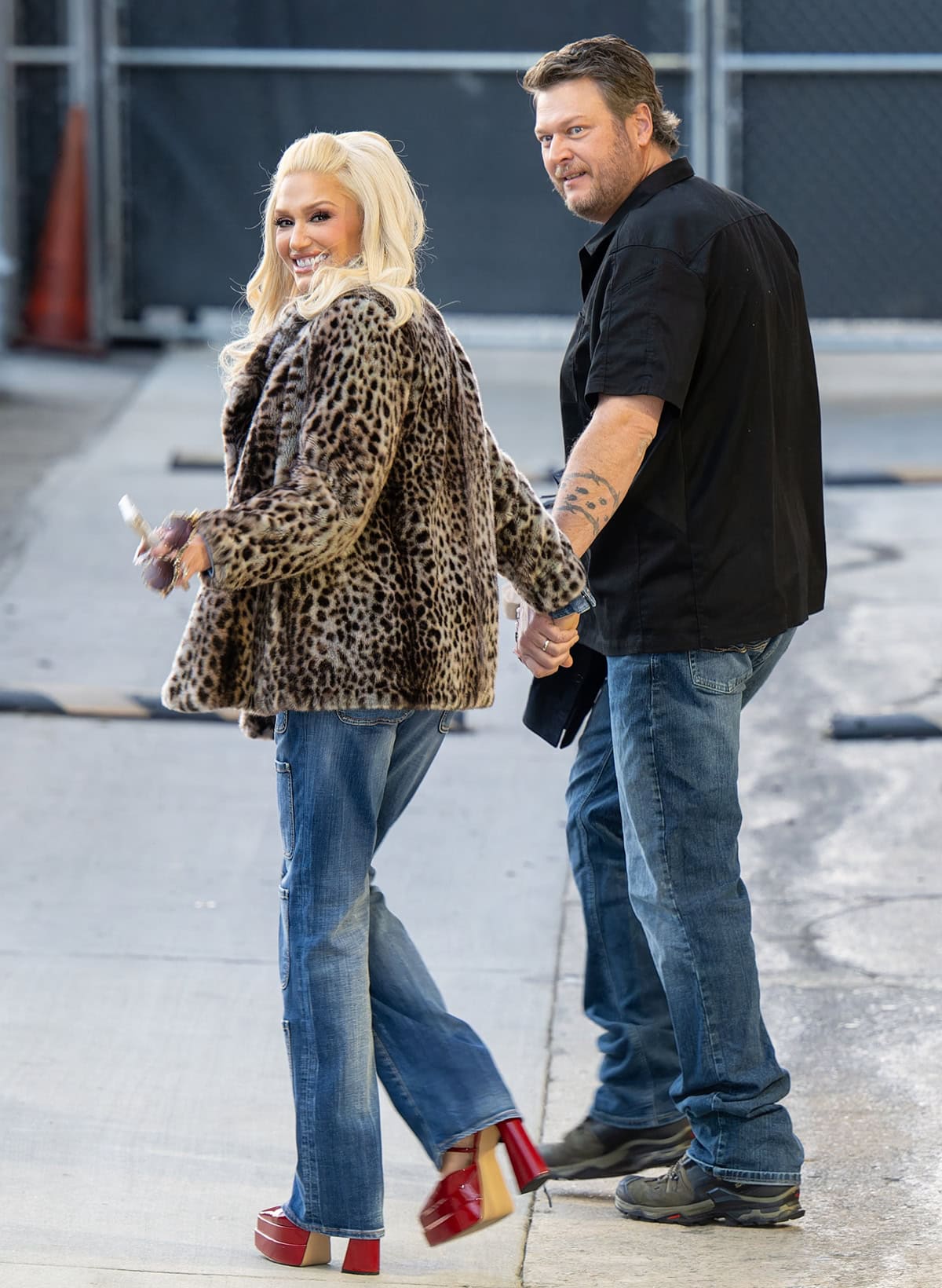 Gwen Stefani, standing at 5 feet 6 inches, and Blake Shelton, at 6 feet 4 inches, showcase their ten-inch height difference while arriving at the Jimmy Kimmel show on February 14, 2024, in Hollywood, California