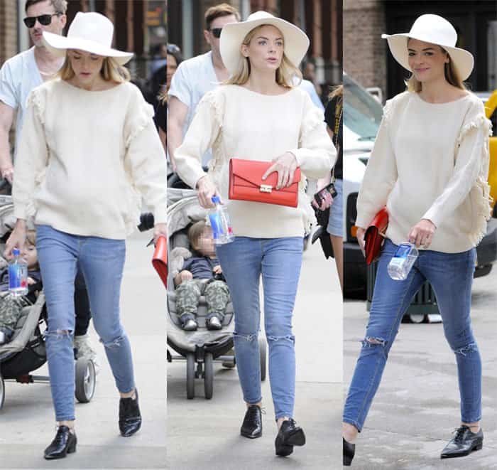 Jaime King wears ripped jeans with an oversized sweater in SoHo