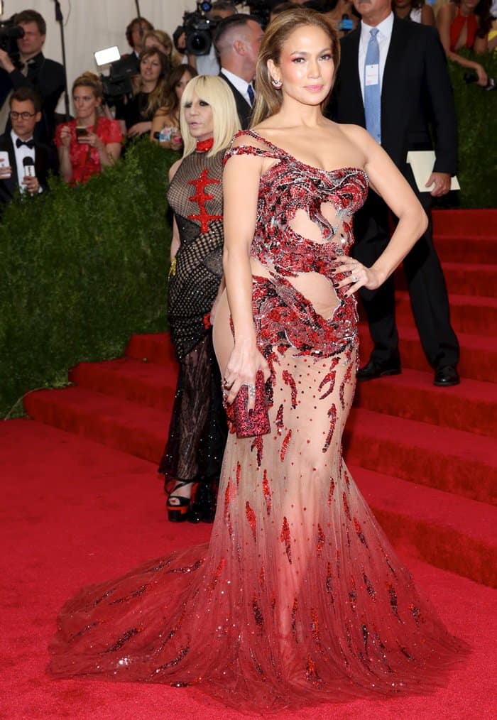 Jennifer Lopez's one-shoulder dress featured sheer panels and was adorned with a dramatic fire-breathing dragon motif that twisted around her torso, with hot-crimson beaded flames encircling the fabric