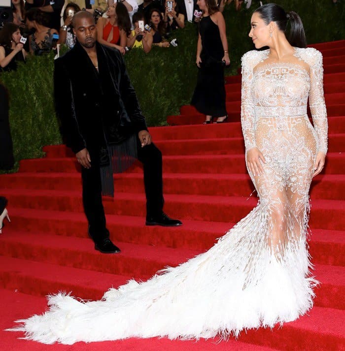Kim Kardashian's dress featured intricate embroidery with crystals, sequins, and bugle beads and was finished with a train of ivory ostrich feathers
