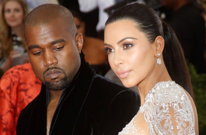 Kanye West caught sneaking a peek at Kim Kardashian's dazzling gown at the 2015 Met Gala
