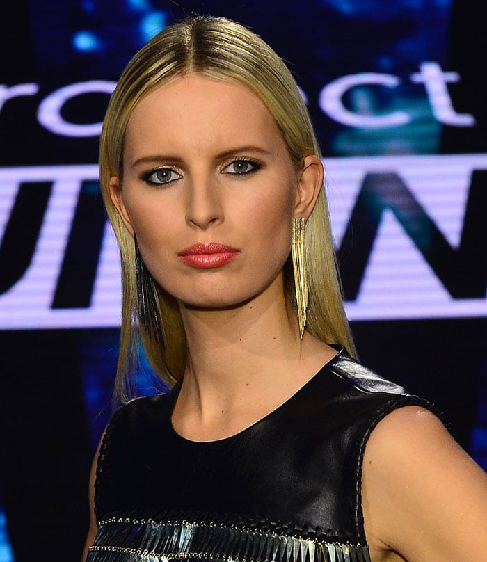 Karolina Kurkova wore her blonde hair straight with a center part to highlight her long fringed earrings