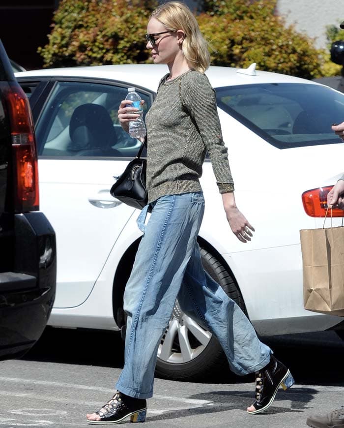 Actress Kate Bosworth completed her chic look with lace-up Rodarte reptile booties