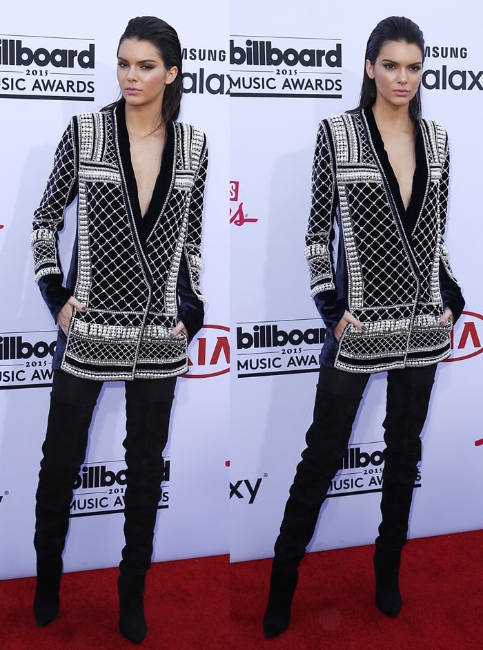 Kendall Jenner paired a pearl-embellished, over-sized jacket paired with black thigh boots