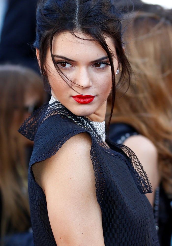 Kendall Jenner put on bright red lipstick as the center point for her look