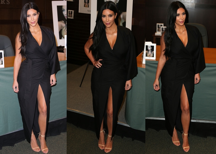 Kim Kardashian was wearing a gorgeous asymmetrical black wraparound dress with a center slit, which she wore with nude heels and minimal jewelry