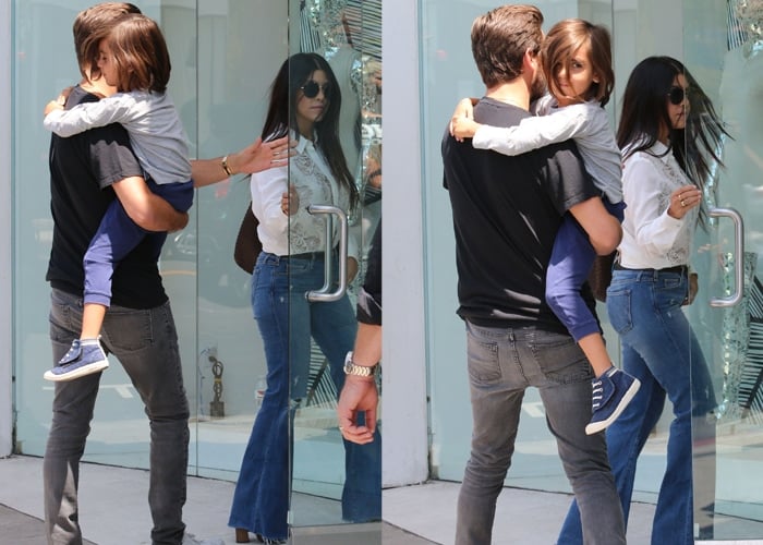 Kourtney Kardashian filming for Keeping Up with the Kardashians with Scott Disick