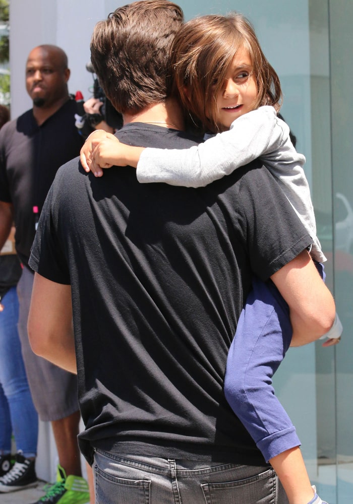 Scott Disick carrying his oldest son Mason Dash Disick