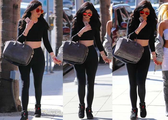 Kylie Jenner flaunted her tummy in a black cropped top from American Apparel