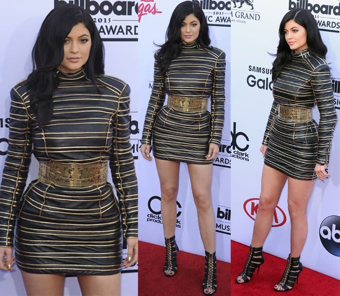 Kylie Jenner stuns in a gold lurex striped leather dress paired with Balmain “Hopi” leather cage sandals at the 2015 Billboard Music Awards