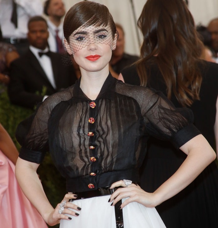 Lily Collins wears a birdcage veil at the 2015 Met Gala