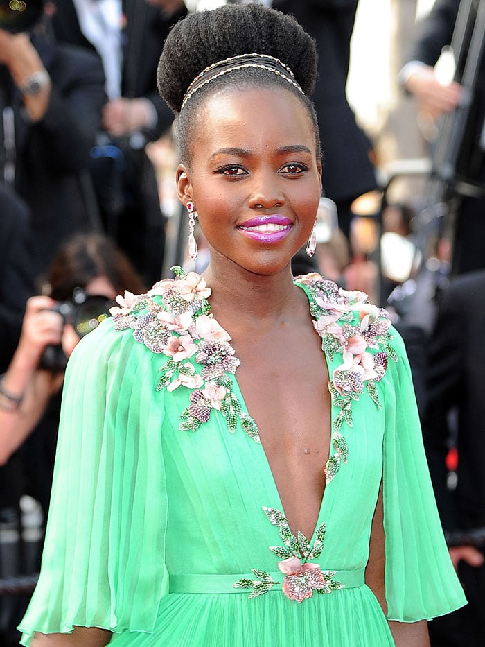 Lupita Nyong'o wearing Chopard drop earrings and an antique Gucci hairband