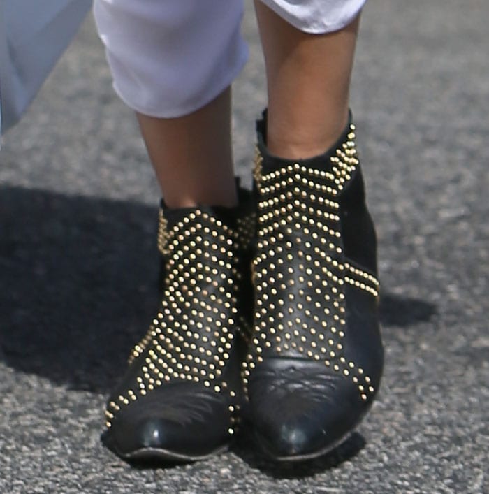 Rendered in a mix of leather and suede and detailed with rows of studs, Malin Akerman's sophisticated booties are truly eye-catching