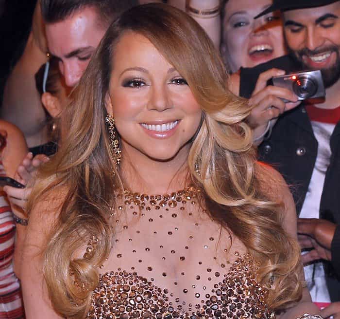 Mariah Carey radiates joy in a stunning gold-embellished gown at her Las Vegas residency event