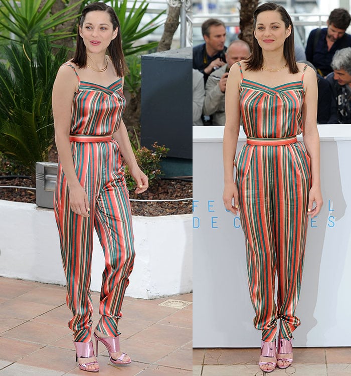 Marion Cotillard stunned in a playful, colorful silk jumpsuit with green, red, and yellow vertical stripes, thin shoulder straps, and a flattering cinched waist, highlighting her slim figure