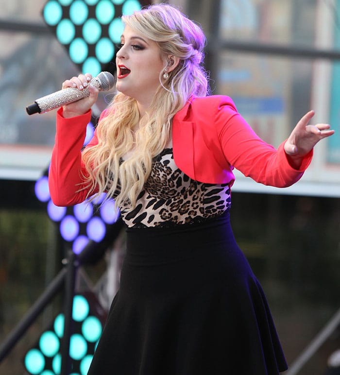 Meghan Trainor's blonde locks were worn in a half-up, half-down style, with loose curls flowing over her shoulders