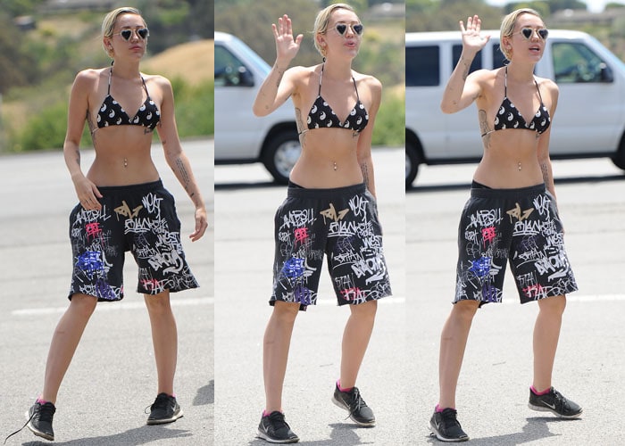 Miley Cyrus in a Yin Yang Bikini from O-Mighty and board shorts from Brian Lichtenberg