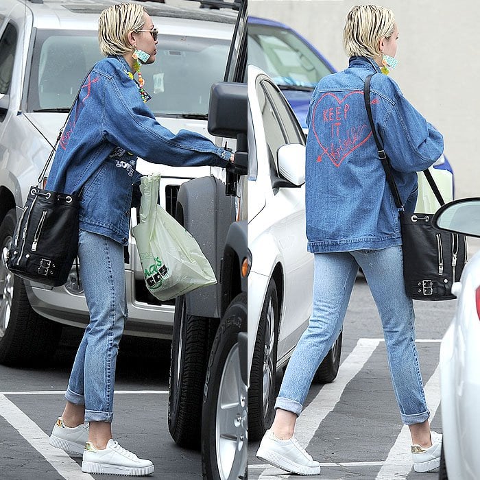 Miley Cyrus' '90s-themed double-denim ensemble complete with a denim jacket that has "Keep It Bright" scribbled on the back