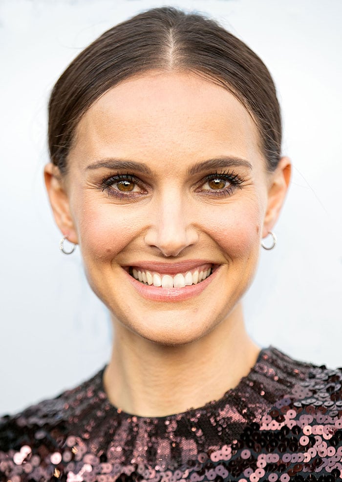 Natalie Portman's brunette hair was pulled back into a sleek low bun with a center parting