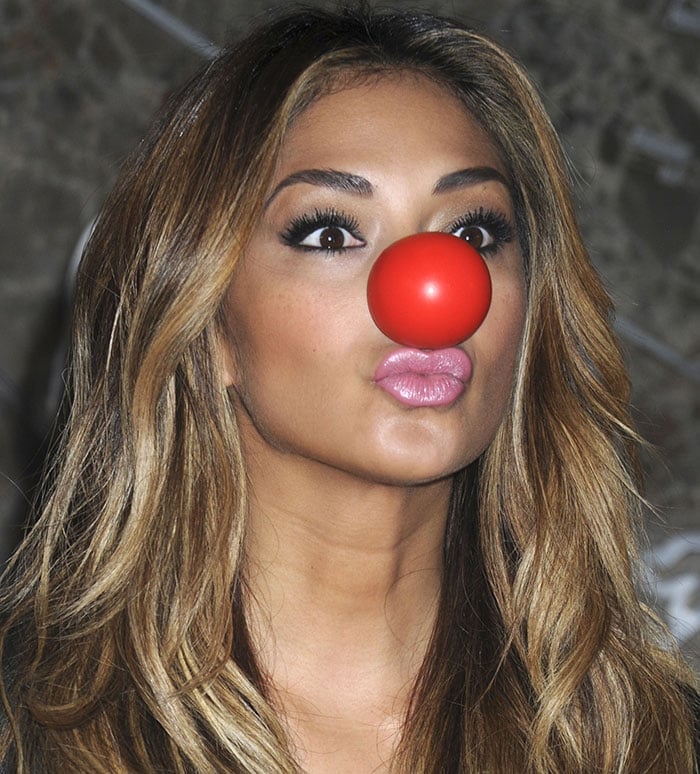 Nicole Scherzinger wears a red nose