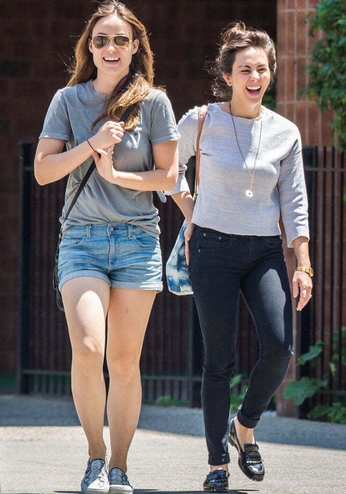 Olivia Wilde in good spirits while out with a friend on a sunny day in Brooklyn