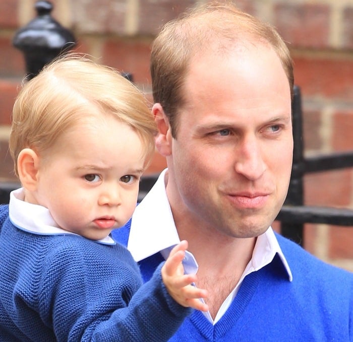 Prince William, Duke of Cambridge, carrying Prince George of Cambridge