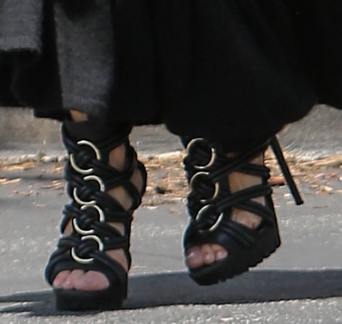 Rachel Zoe wearing a pair of sandals from her own collection