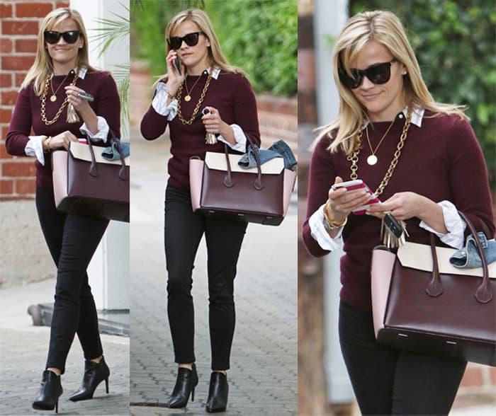 Reese Witherspoon was spotted carrying a Bally Sommet tote bag and wearing a pair of Saint Laurent Classic Paris Chelsea ankle boots while leaving her office in Beverly Hills