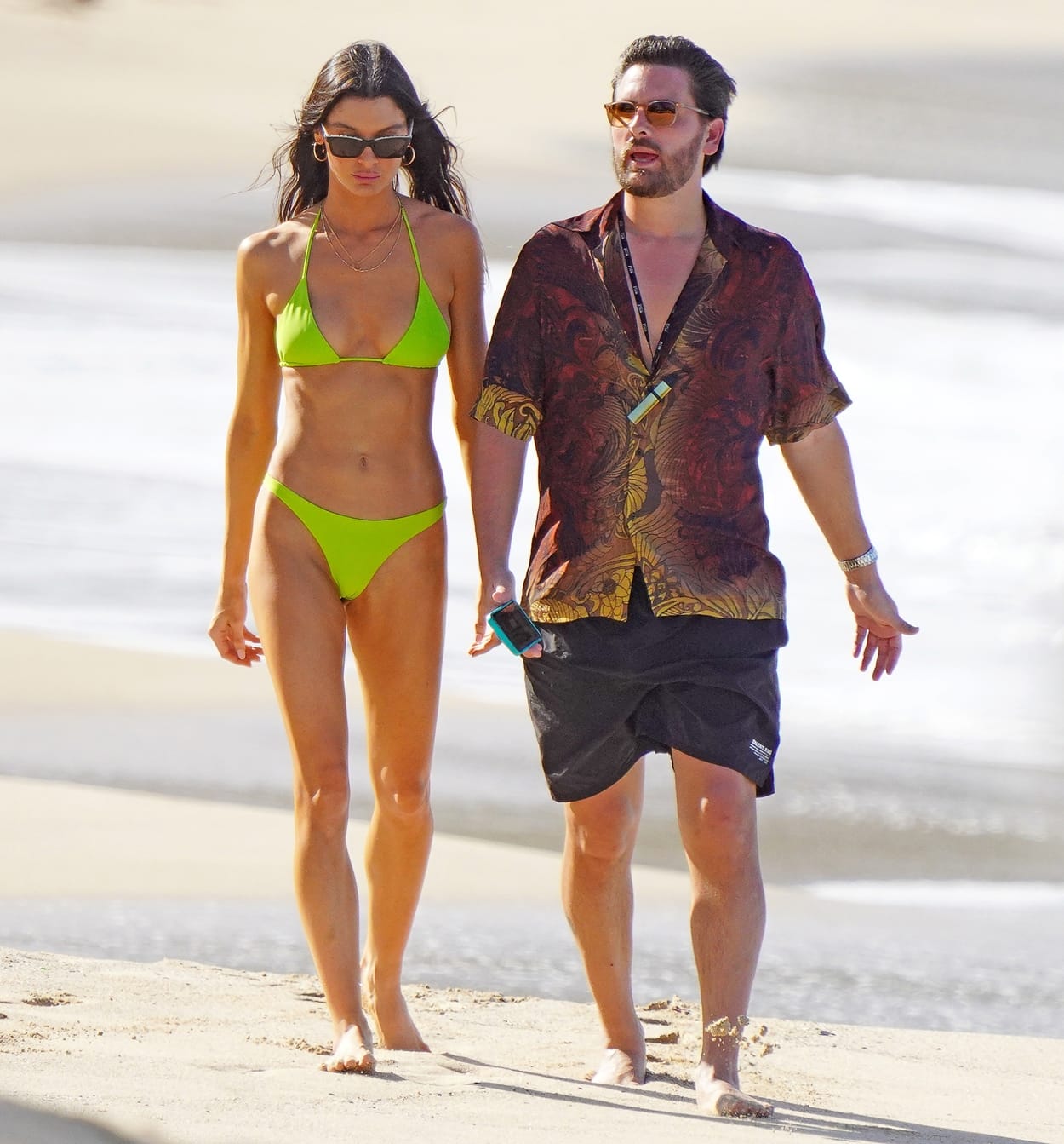Scott Disick and his girlfriend Bella Banos walking the beach in St-Barts