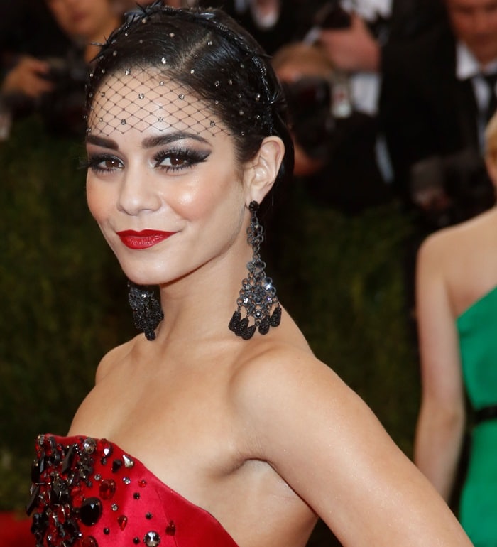 Vanessa Hudgens's black birdcage veil and black chandelier earrings at the 2015 Met Gala