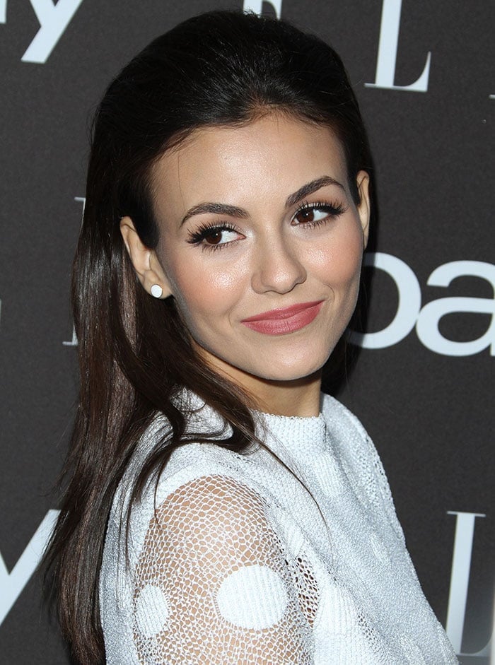 Victoria Justice shows off her stud earrings from Henri Bendel