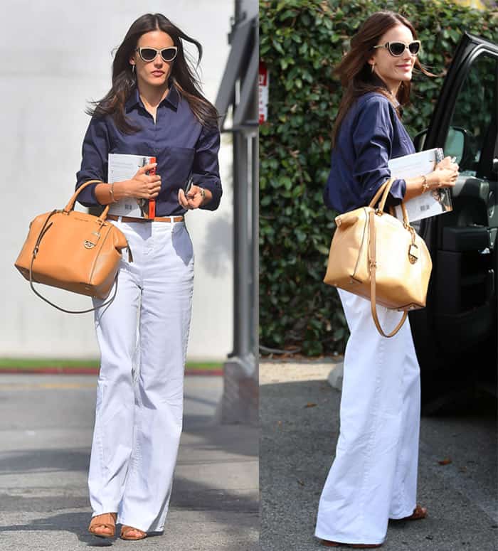 Alessandra Ambrosio wears white flare pants with a dark blue shirt