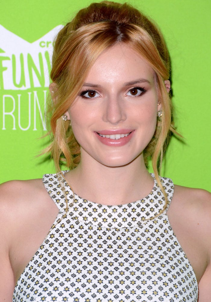 Bella Thorne pulled back her hair into a loose ponytail