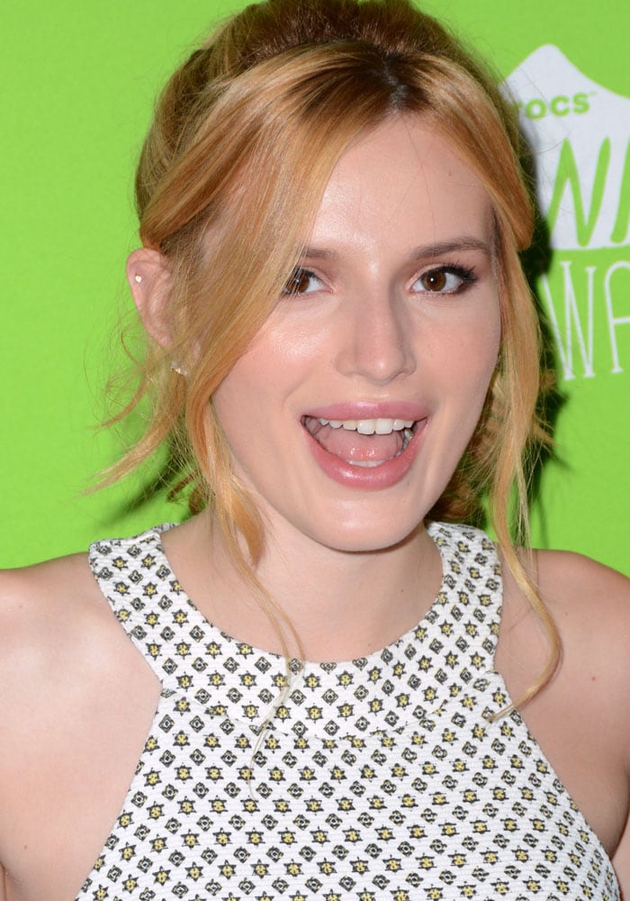 Bella Thorne's open-mouthed cheerleader smile