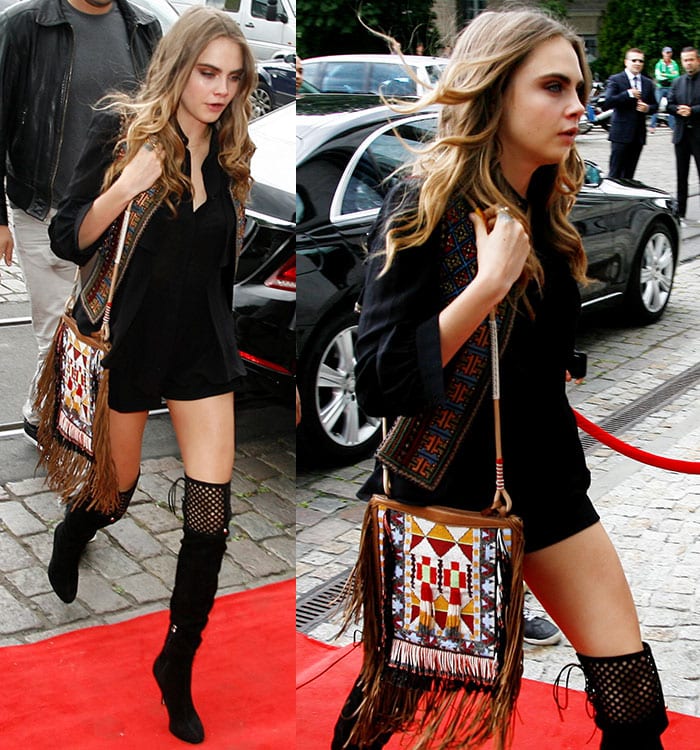 Cara Delevingne's tribal-inspired fringe bag added a punch of color to the outfit